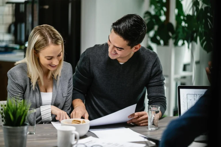 young-happy-couple-going-through-their-housing-pro