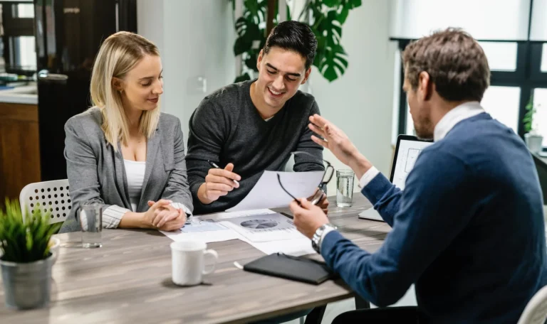 young-happy-couple-reading-terms-mortgage-document